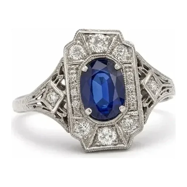 Ornate ring with a blue center stone