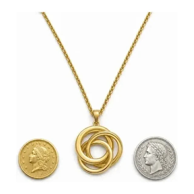 Gold necklace and coins on white